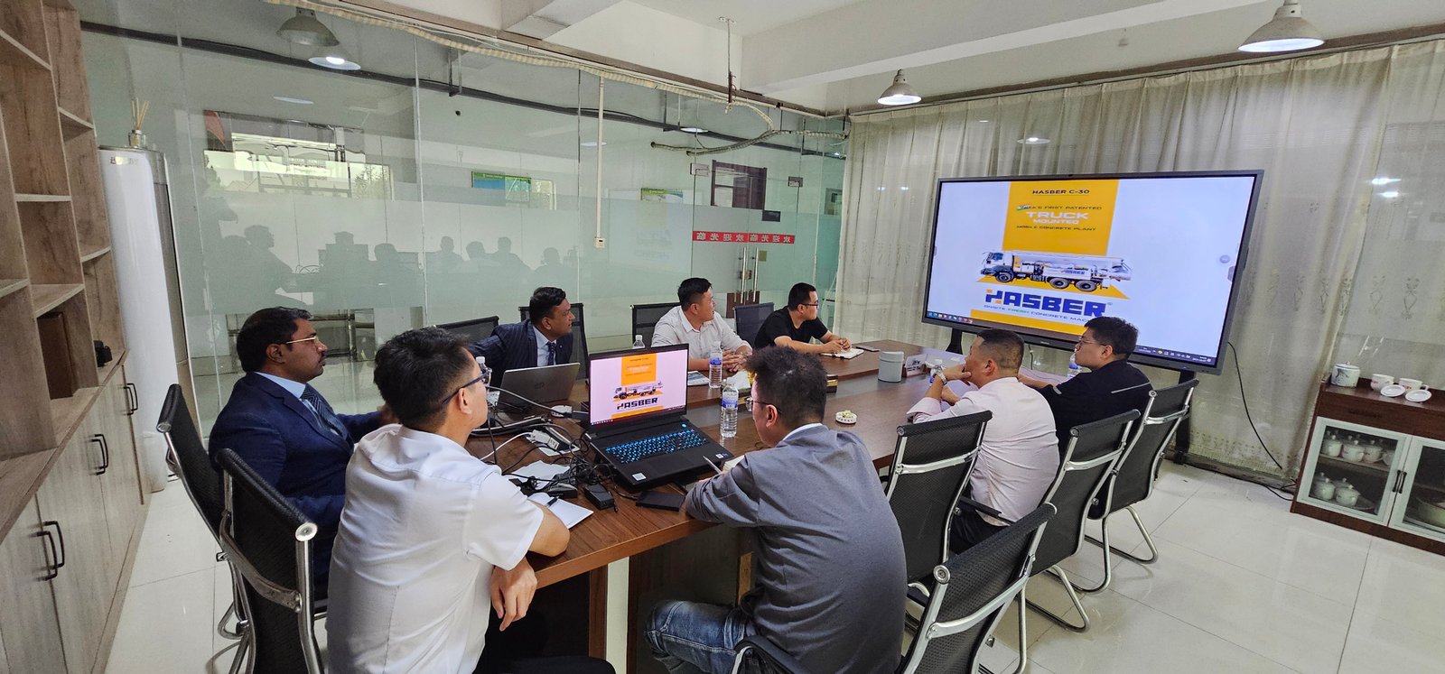 Dr. Akshay Shinde and Dr. Sachin Kate presenting the Hasber Truck to the Sasul Group in Qingdao, China